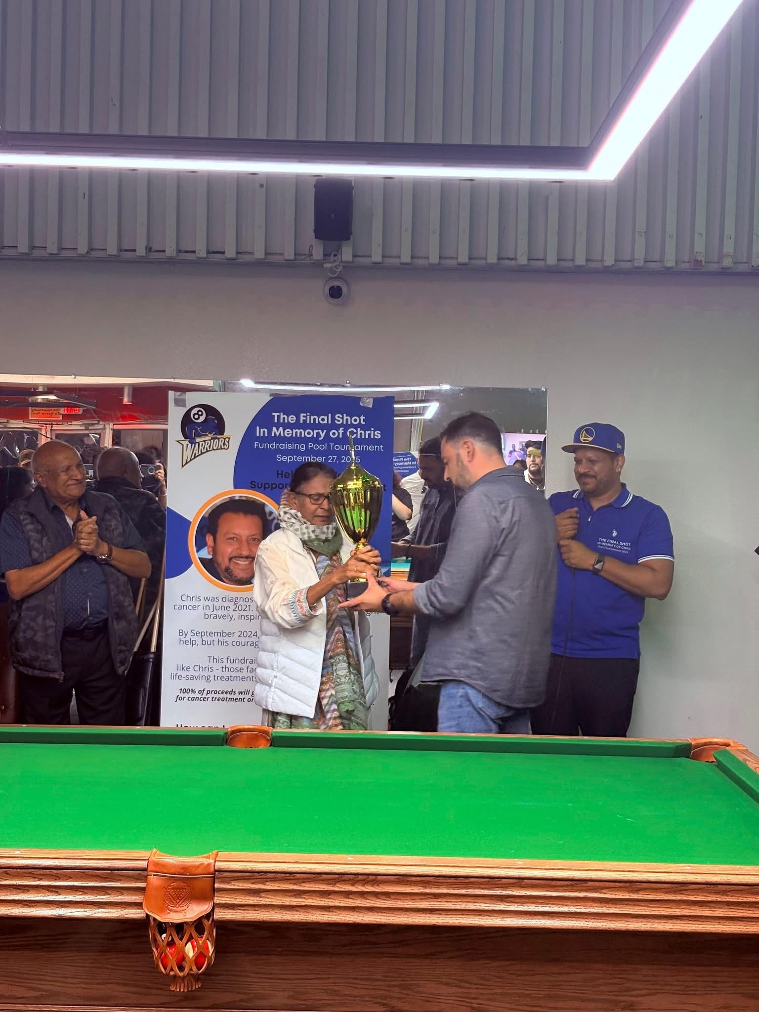 A trophy being presented at The Final Shot