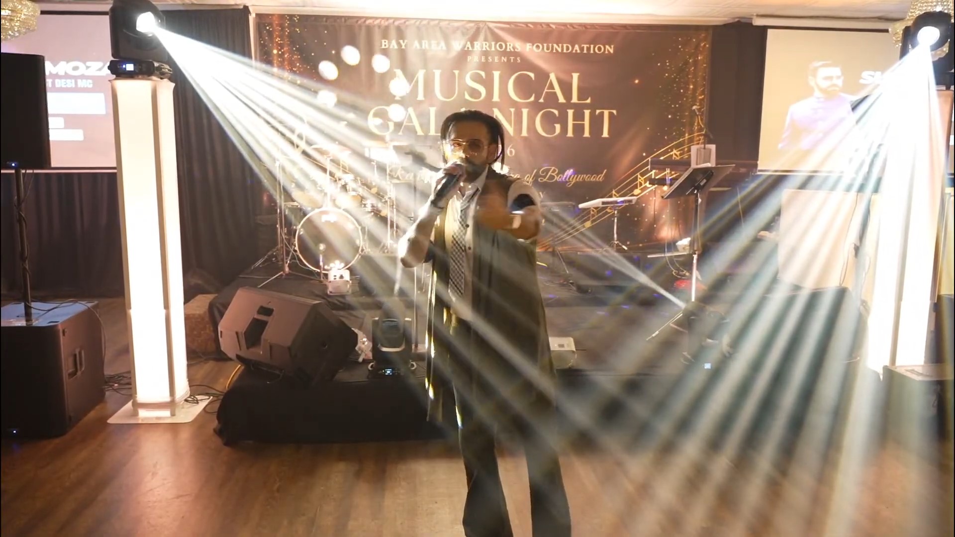 A performer under stage lights
