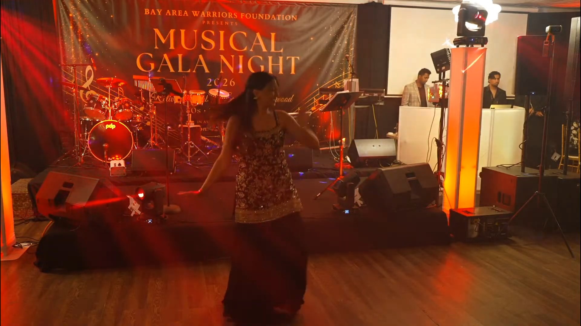 A performer dancing near the gala stage