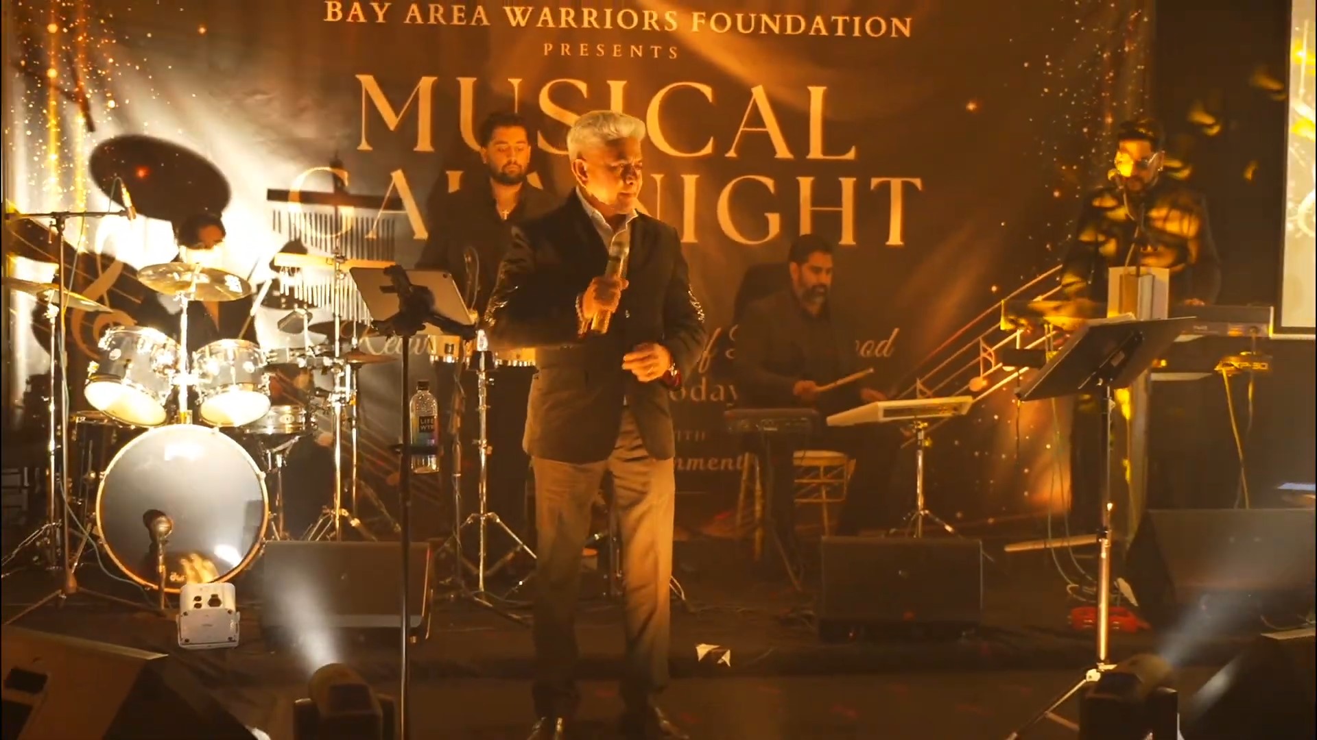 A musician singing on stage