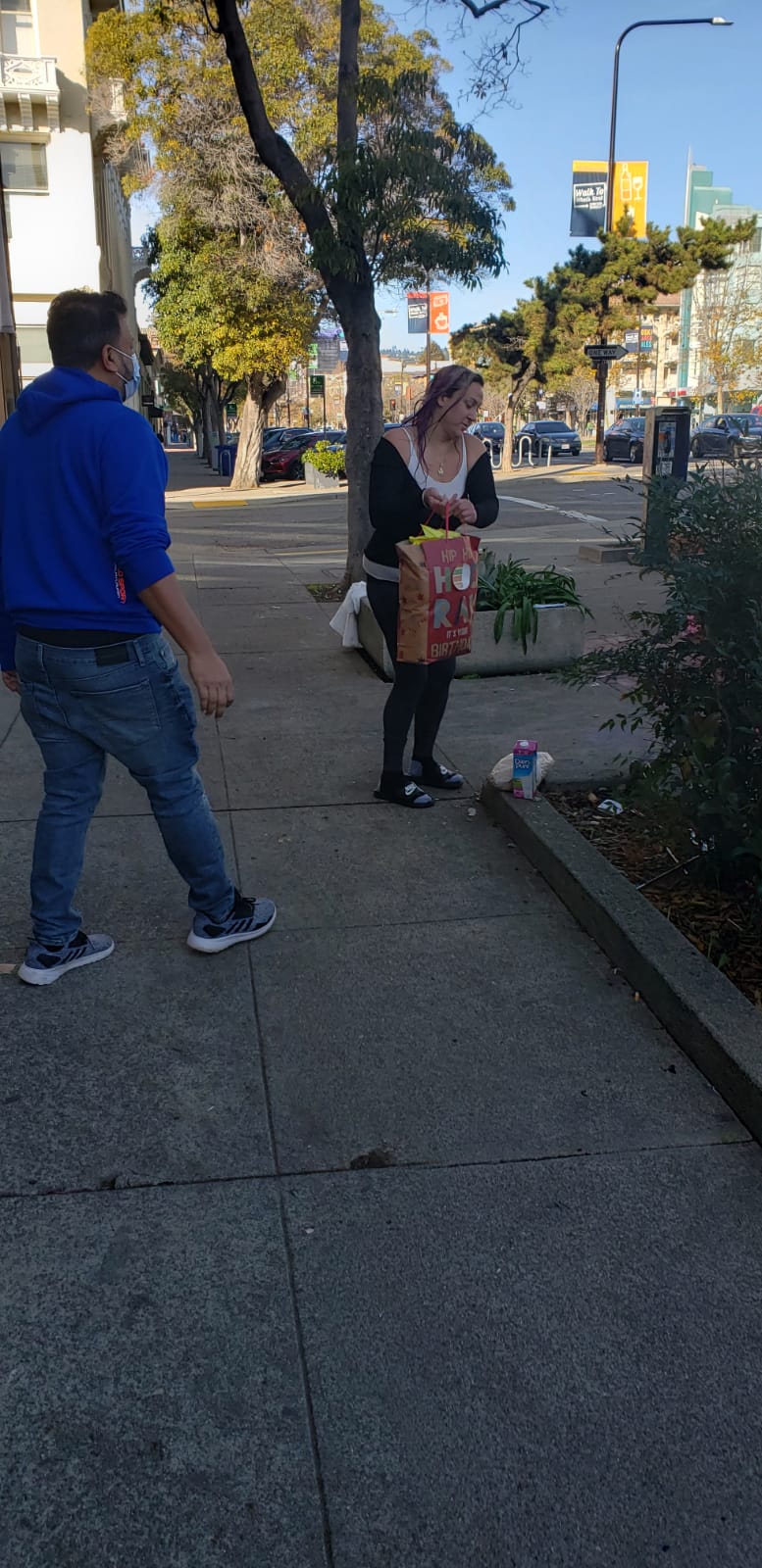 A community outreach visit on a city sidewalk